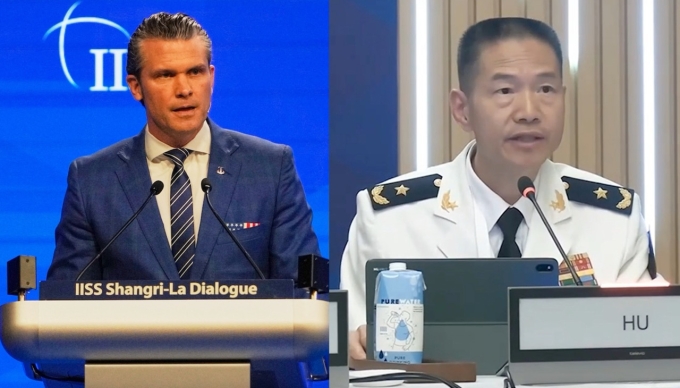 Bộ trưởng Quốc phòng Mỹ Pete Hegseth (trái) và tướng Hu Gangfeng, trưởng phái đoàn đại diện PLA, phát biểu ở sự kiện Đối thoại Shangri-La ngày 31/5 tại Singapore. Ảnh: AP