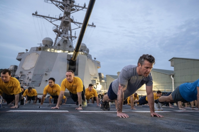 Secretary of Defense Pete Hegseth participates in a troop PT session with troops aboard Arleigh Burke-class guided-missile destroyer USS Dewey (DDG 105) during his visit to Singapore for the Shangri-La Dialogue, May 30, 2025. (DoD photo by U.S. Navy Petty Officer 1st Class Alexander Kubitza)