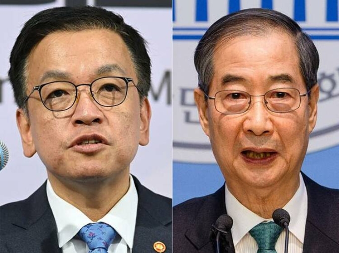Cựu bộ trưởng tài chính Hàn Quốc Choi Sang-mok (trái) và cựu thủ tướng Han Duck-soo. Ảnh: AFP