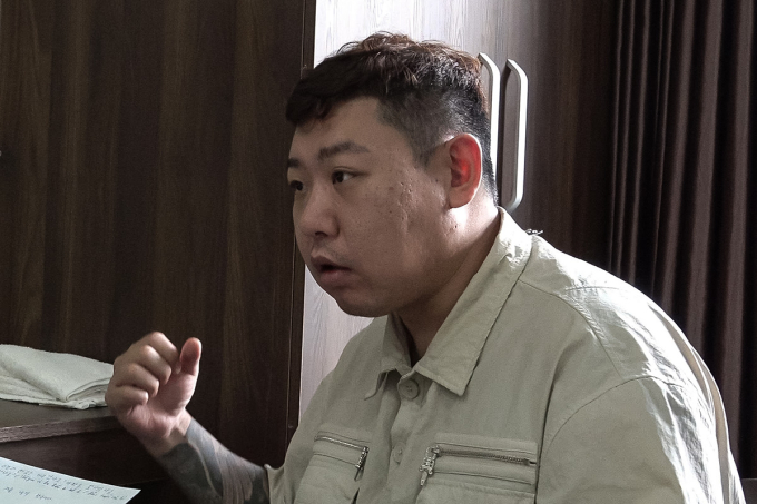 Hong Sangwoo khi bị bắt. Ảnh: Lê Tiến